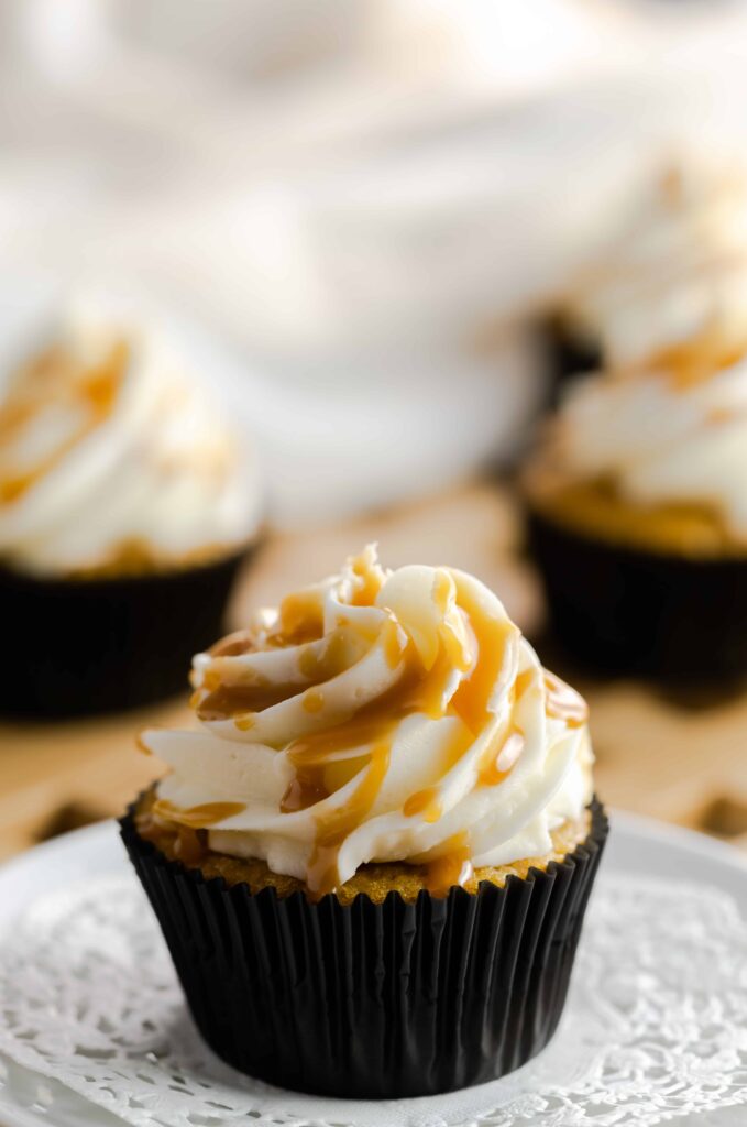 Butterscotch cupcakes drizzled with butterscotch sauce. 