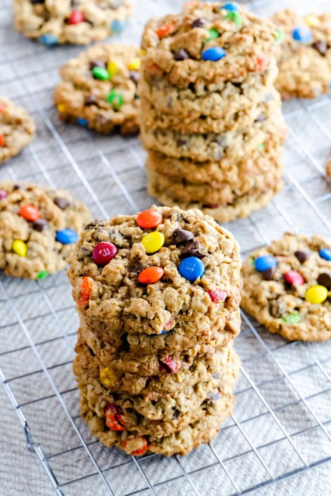 Two stacks of monster cookies that are gluten-free and peanut-free. 