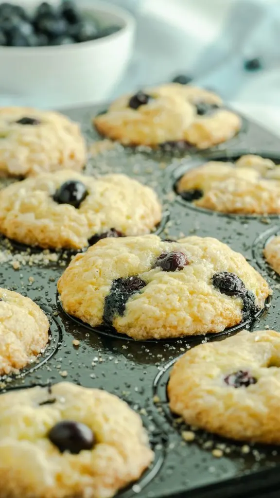 Close up of blueberry muffins in a muffin pan.