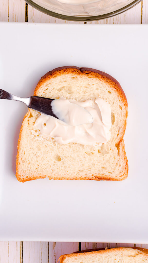 Cheese spreader with cream cheese on thick slice bread.