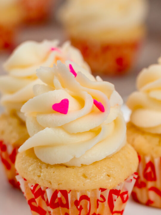 Mininuare Vanilla Valentine's Day Cupcakes in seasonal wrappers.